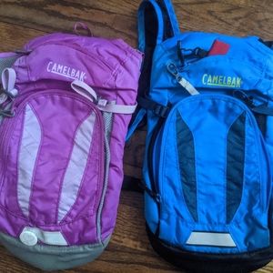 Three Kid's Camelback backpacks...does not include water boadder.